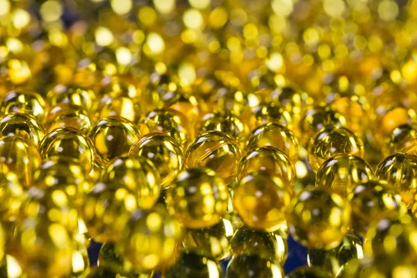 Yellow medical capsules — Stock Photo, Image