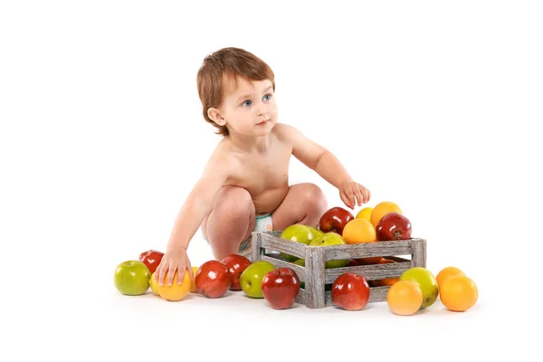 Smiling baby boy with applesfruits — Stock Photo, Image