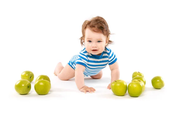 Smiling baby boy with apples — Stock Photo, Image