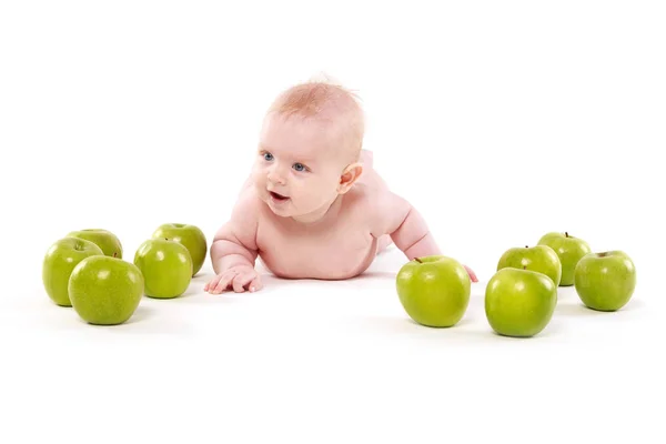 Smiling baby girl with apples — Stock Photo, Image