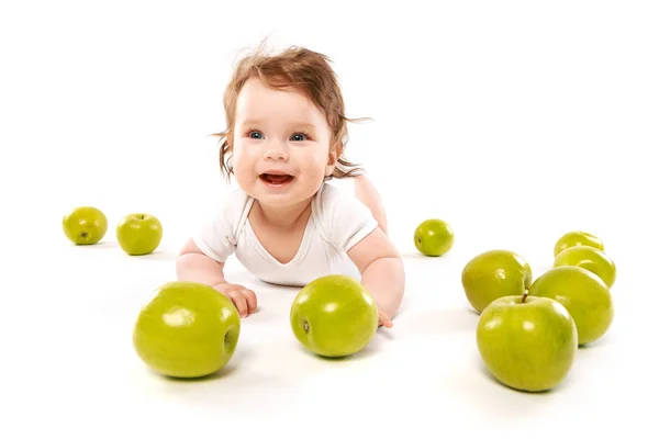 Smiling baby boy with apples — Stock Photo, Image