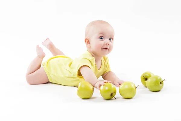 Smiling baby boy with apples — Stock Photo, Image