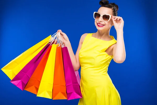 Brunette girl with shopping bags — Stock Photo, Image