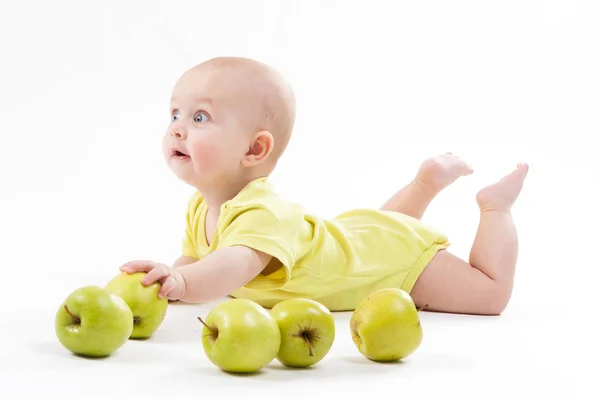 Smiling baby boy with apples — Stock Photo, Image