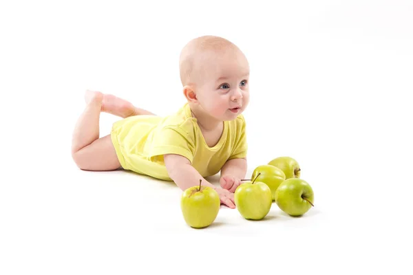Smiling baby boy with apples — Stock Photo, Image