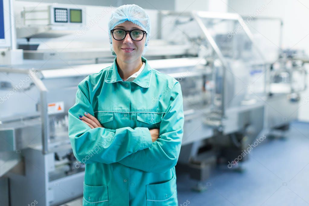 scientist is standing near machine at factory