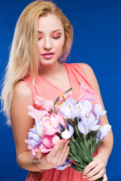 Young girl with flowers in hands — Stock Photo, Image