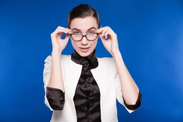 Girl in white jacket and glasses Stock Picture