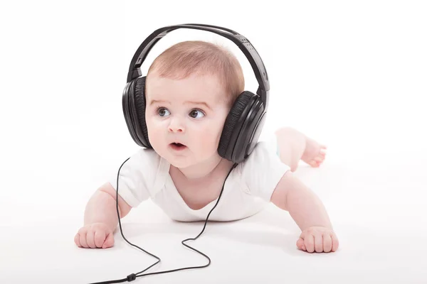 Lindo bebé niño en auriculares — Foto de Stock