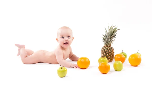 Cute baby boy with fruits — Stock Photo, Image