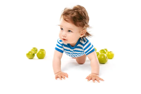 Smiling baby boy with apples — Stock Photo, Image