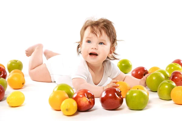 Smiling baby boy with applesfruits — Stock Photo, Image