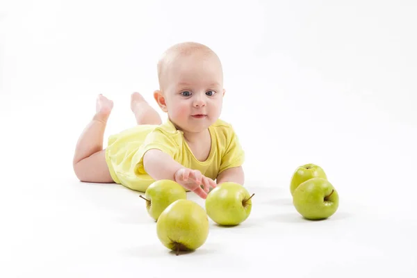 Smiling baby boy with apples — Stock Photo, Image