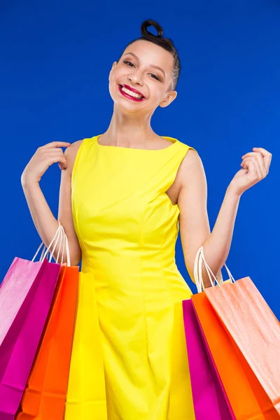 Brunette girl with shopping bags — Stock Photo, Image