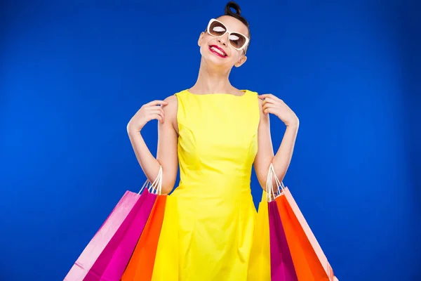 Brunette girl with shopping bags — Stock Photo, Image