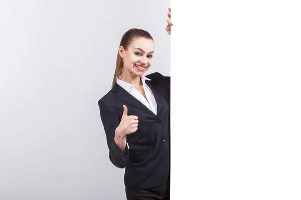 Young businesswoman next to a whiteboard — Stock Photo, Image