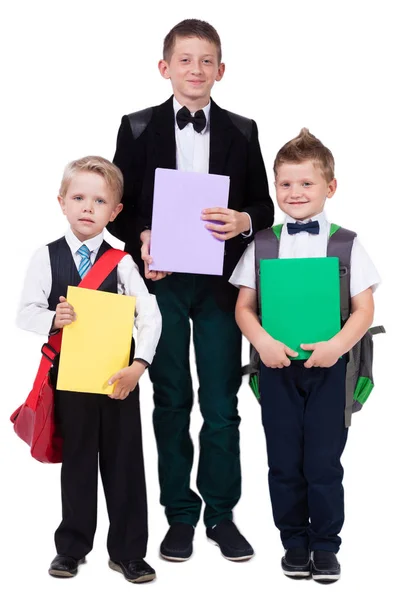 Senior skolpojke och två barn med böcker — Stockfoto
