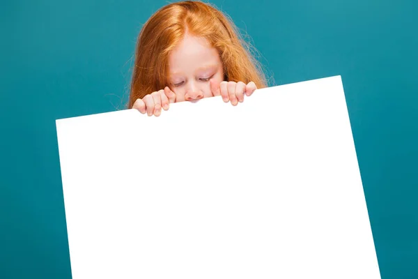 Cute redhead girl with empty poster — Stock Photo, Image