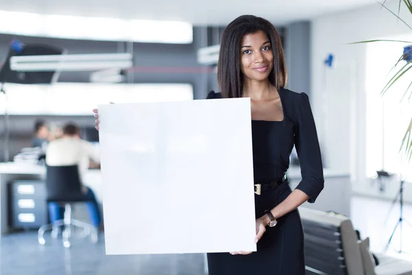 Young business lady with empty paper