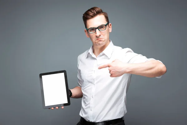 Young businessman holding tablet — Stock Photo, Image