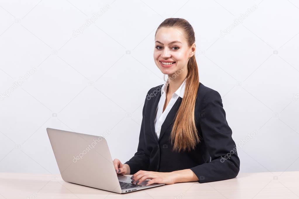 Businesswoman working on a laptop in office