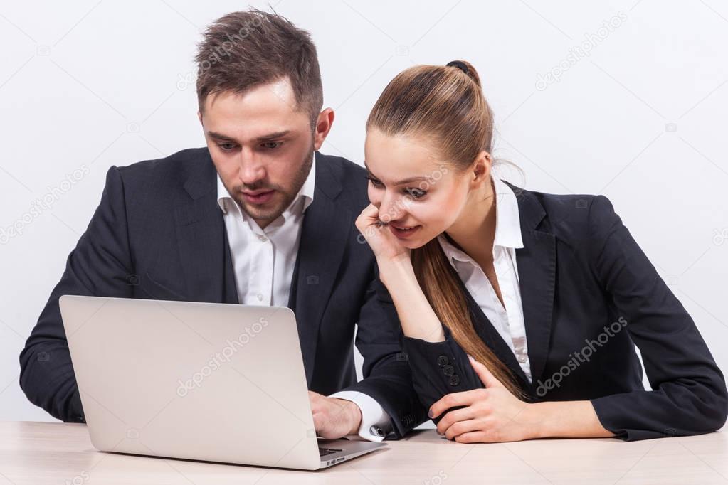 Businesspeople working on laptop  