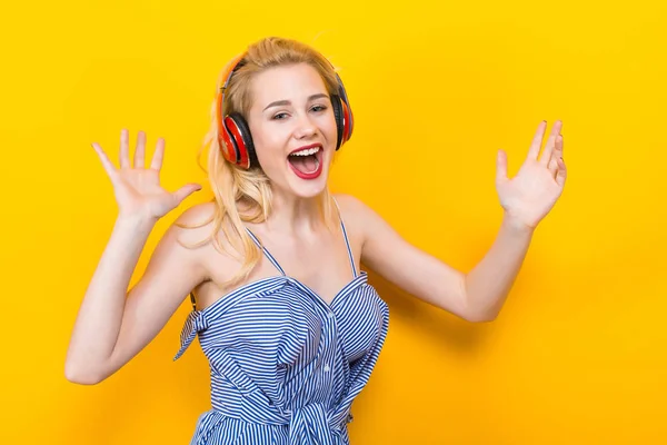 Beautiful Emotional Young Woman Listening Music Headphones Yellow Background — Stock Photo, Image