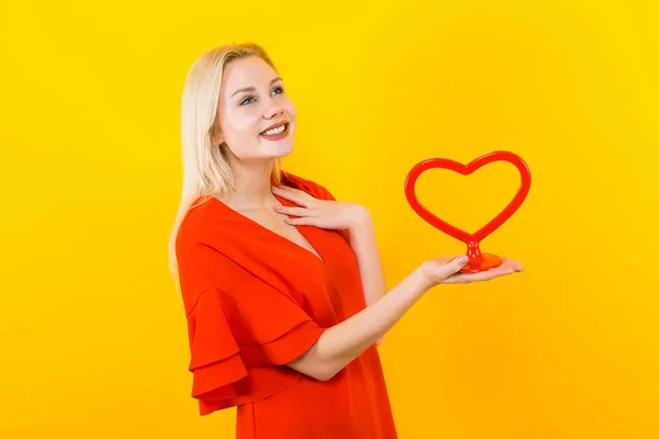 Beautiful Young Woman Red Dress Holding Red Heart Yellow Background — Stock Photo, Image