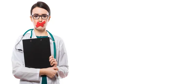 Young Female Doctor Plaster Her Mouth Holding Clipboard — Stock Photo, Image