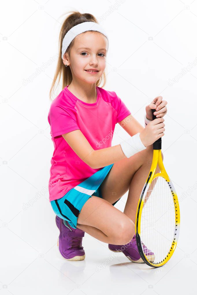 Cute little female squash player isolated on white 