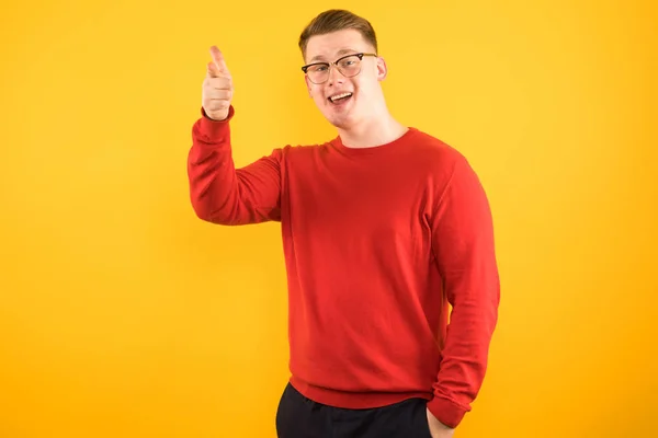 Smiling Blonde Guy Pointing Finger — Stock Photo, Image