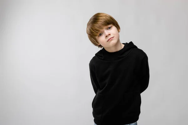 Cute Caucasian Boy Black Outfit Showing Different Expressions White Wall — Stock Photo, Image