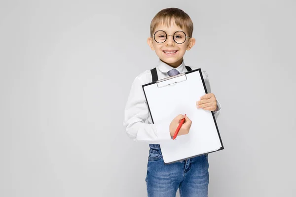 Portrait Adorable Serious Confident Little Boy Glasses Holding Clipboard Grey — Stock Photo, Image