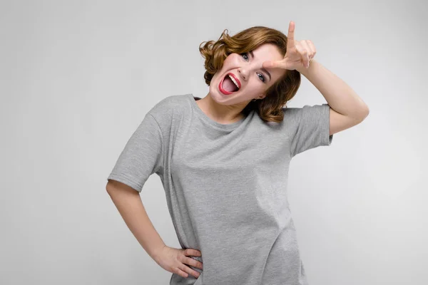 Portrait Beautiful Redhead Happy Young Woman Showing Loser Sign Gray — Stock Photo, Image