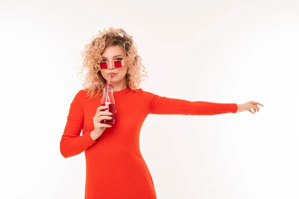 Young Woman Red Dress Posing Beverage White Background — Stockfoto