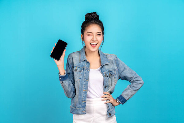 Happy Asian Woman Feeling Happiness Blinks Eyes Standing Hold Smartphone Stock Image