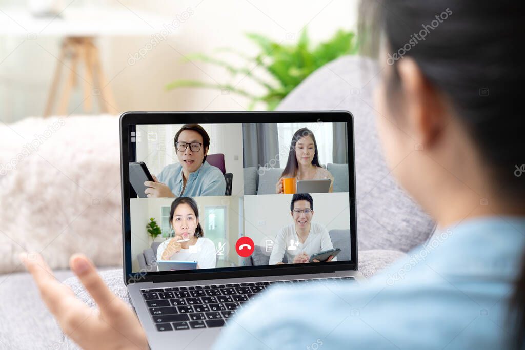 Group of young happy asian work from home meeting or brainstorming online video conference application on 5G internet with covid coronavirus business continuity plan via tablet or notebook computer.