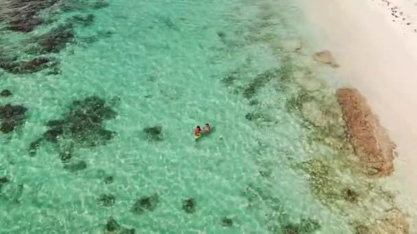 Travel vacation paradise aerial drone video of young beautiful couple — Stock Video