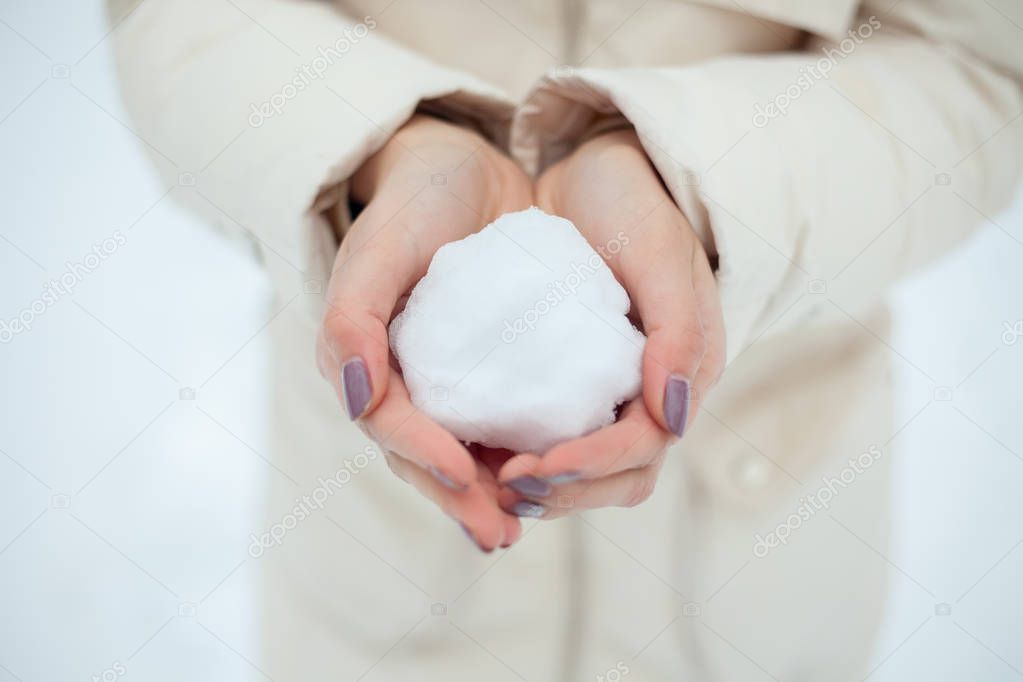 Girl throws snowball
