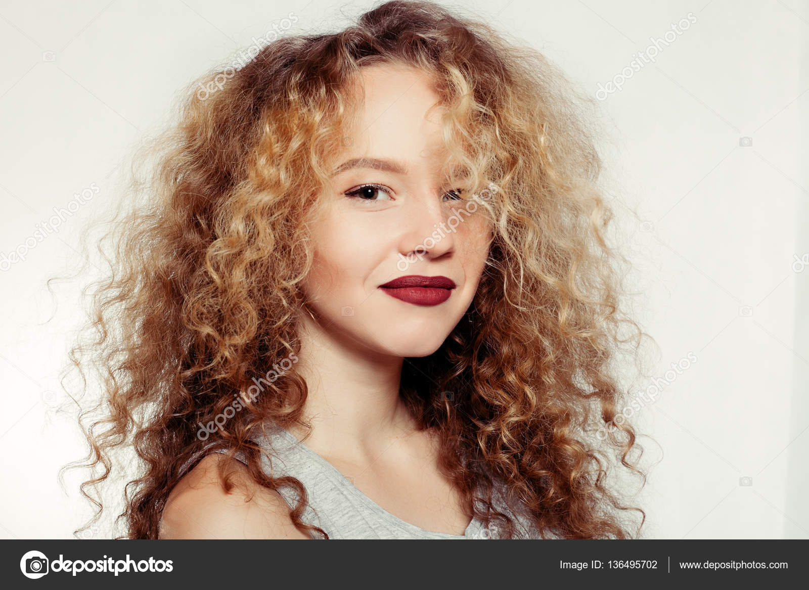 Beauty Young Woman With Curly Big And Long Hair Stock Photo