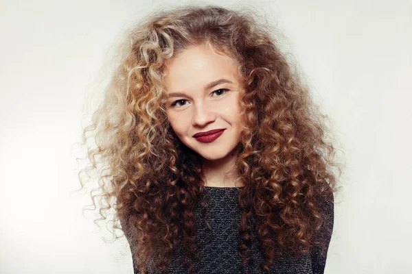 Beauty young woman with curly big and long hair. — Stock Photo, Image