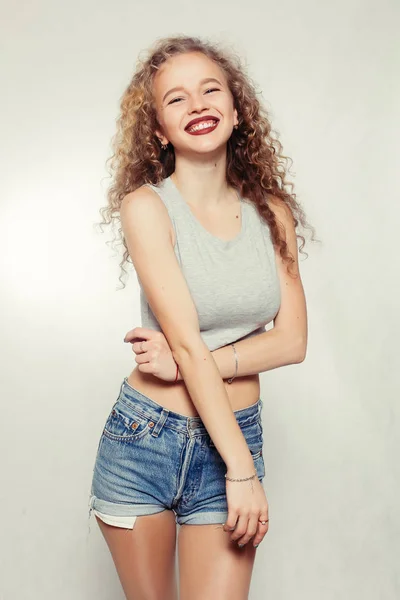 Beauty young woman with curly big and long hair. — Stock Photo, Image