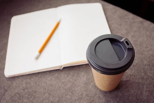 Pencil, notebook and paper coffee cup — Stock Photo, Image