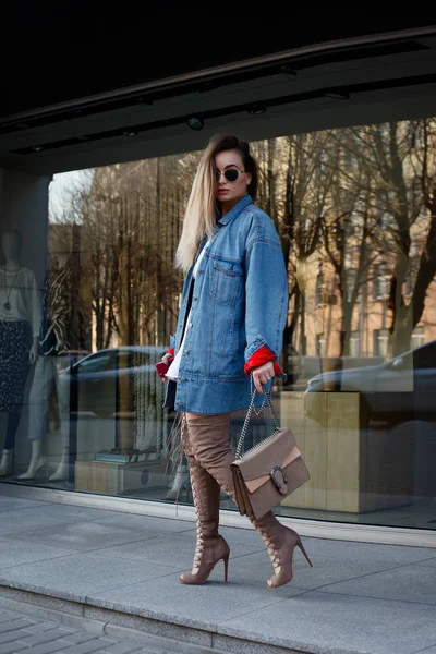 beautiful young woman with over the knee boots