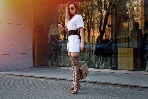 beautiful young woman with over the knee boots