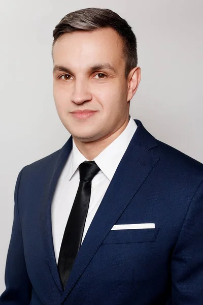 Portrait of handsome man in black blue suit — Stock Photo, Image