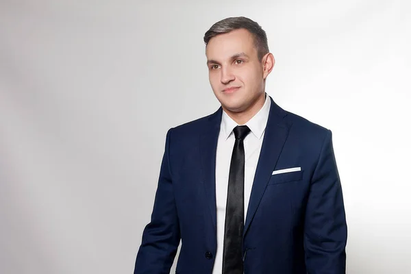 Portrait of handsome man in black blue suit — Stock Photo, Image