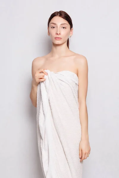 Beautiful woman in white bathrobe after spa — Stock Photo, Image