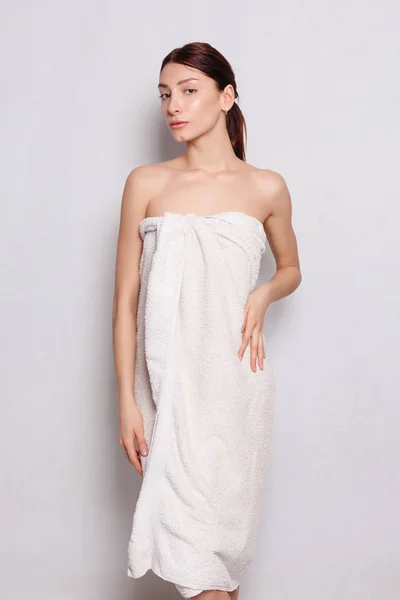 Beautiful woman in white bathrobe after spa — Stock Photo, Image