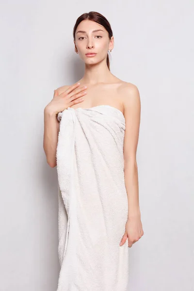 Beautiful woman in white bathrobe after spa — Stock Photo, Image